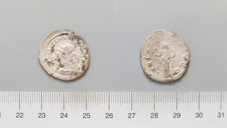 Bronze antoninianus of Gallienus with a thin silver wash, radiate crown on the portrait and a standing figure on the reverse.